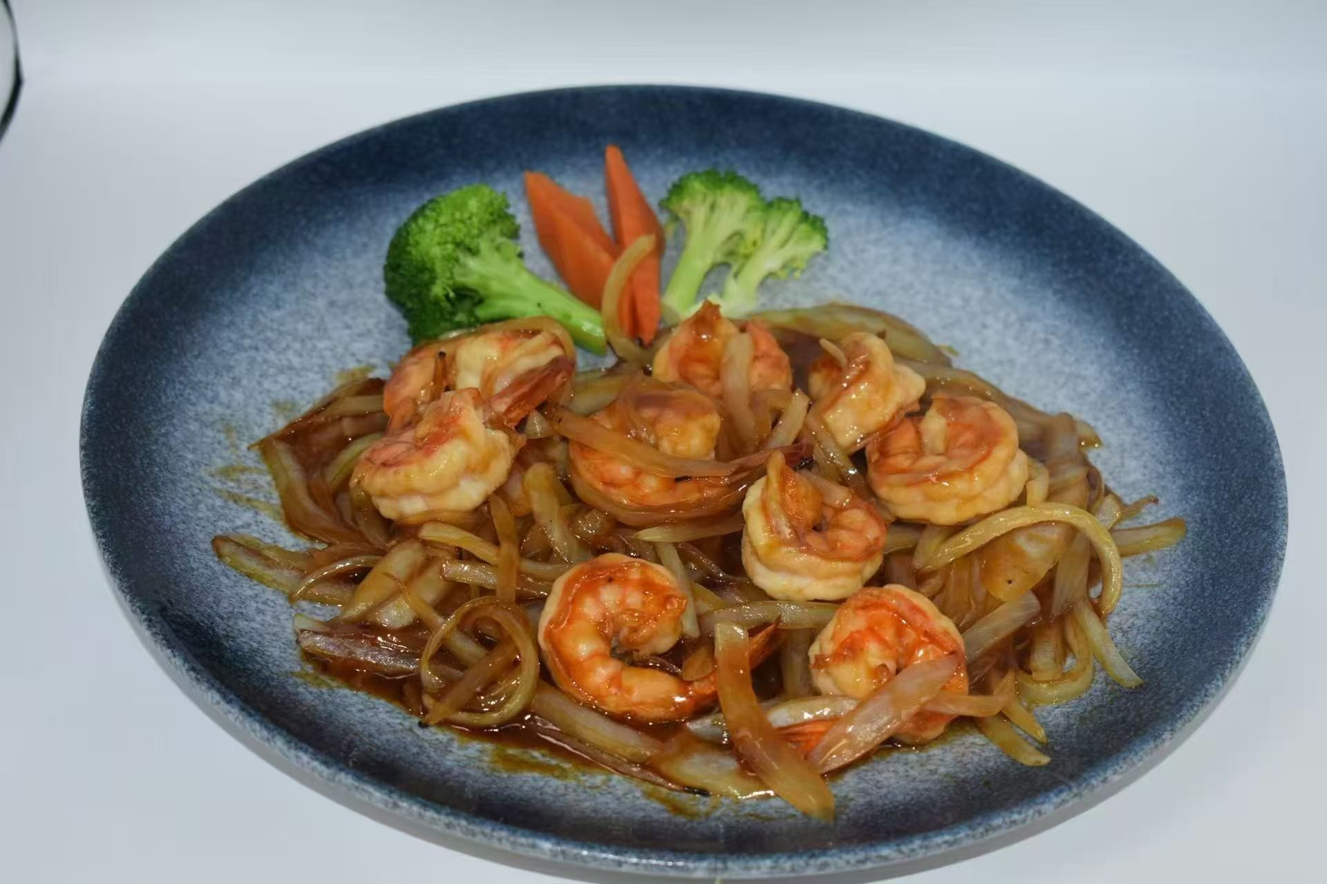 Teriyaki shrimp with onions and veggies at Isohama,a Japanese Restaurant in New York.