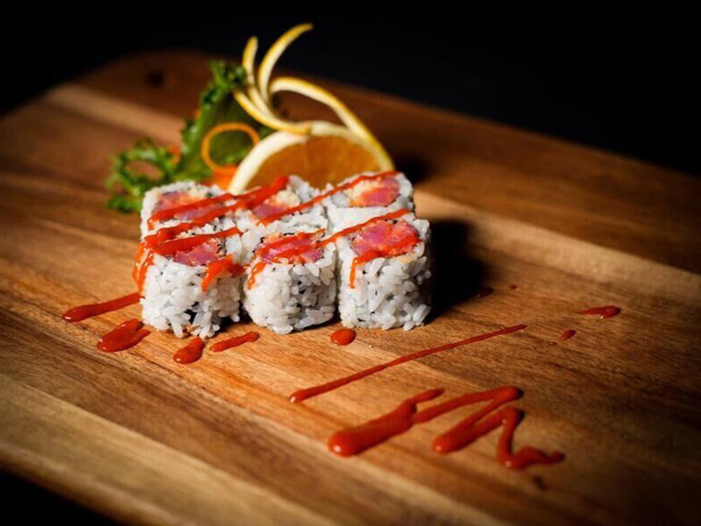 Salmon maki rolls drizzled with red spicy sauce at J-One Hibachi Sushi，a Japanese Restaurant in Dulu