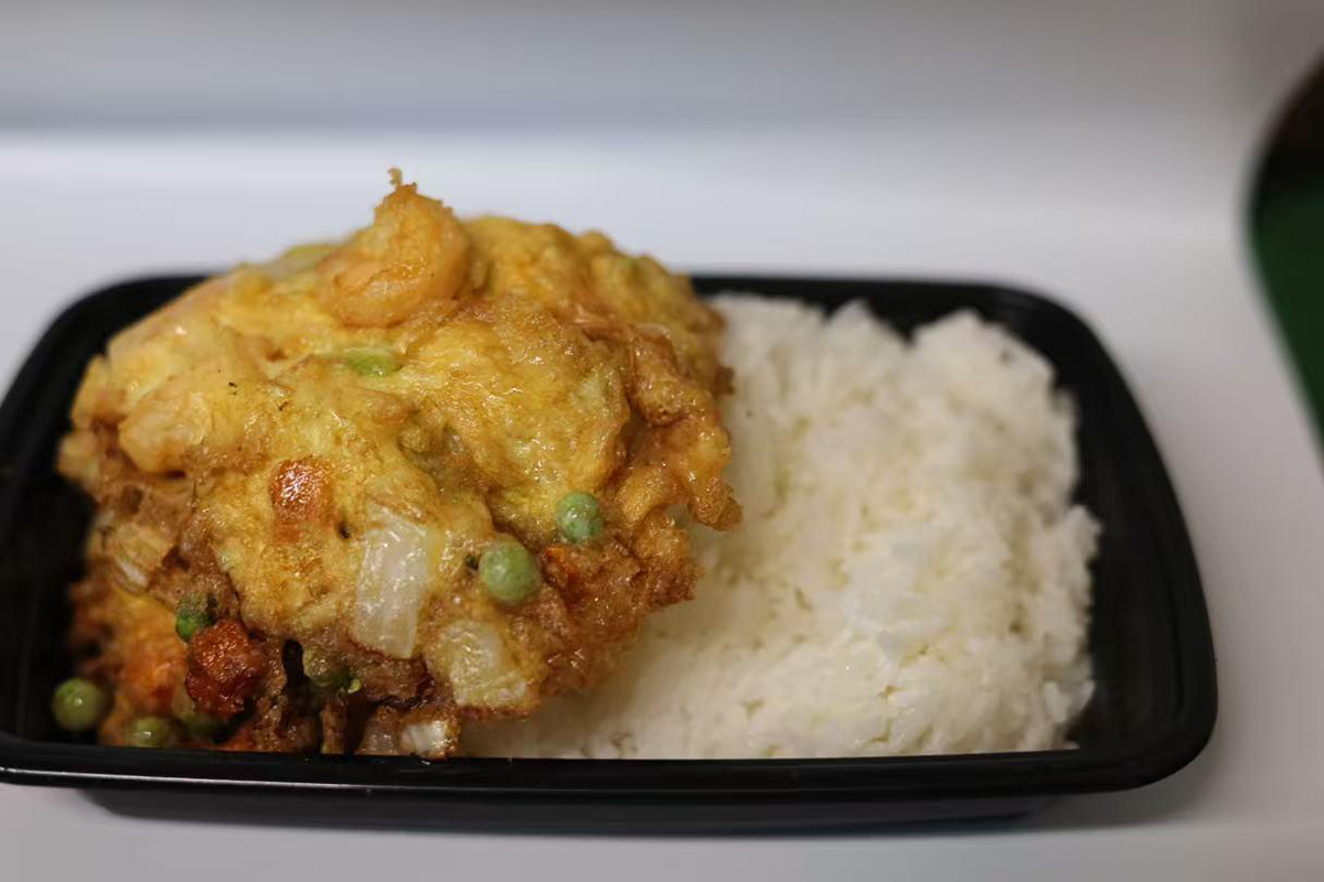 Shrimp omelet combo served with plain steamed white rice at Jackie Chan's Chinese Restaurant in Philadelphia