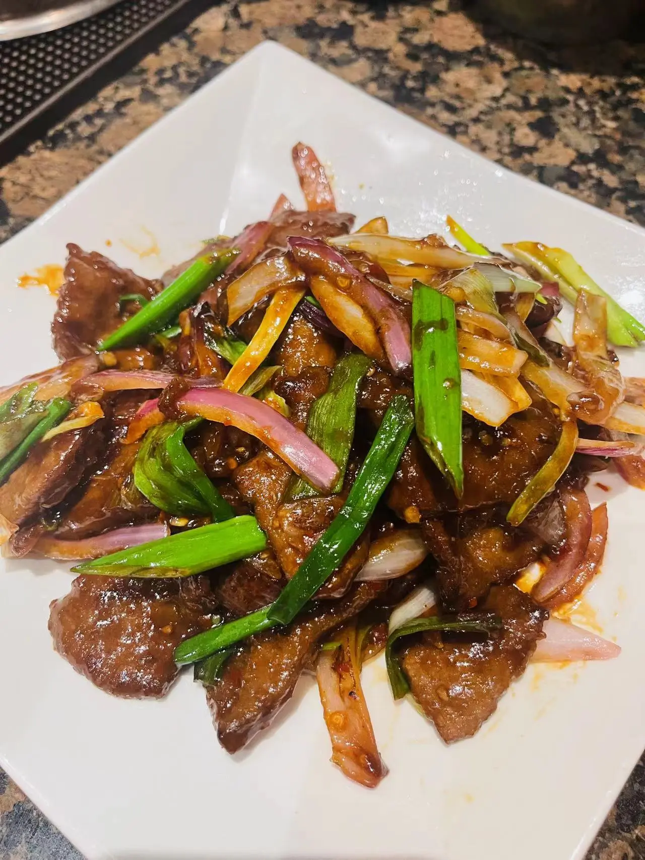 Savory beef stir-fry with scallions at Jade Ly Asian Bistro, a Asian Restaurant in Westminster