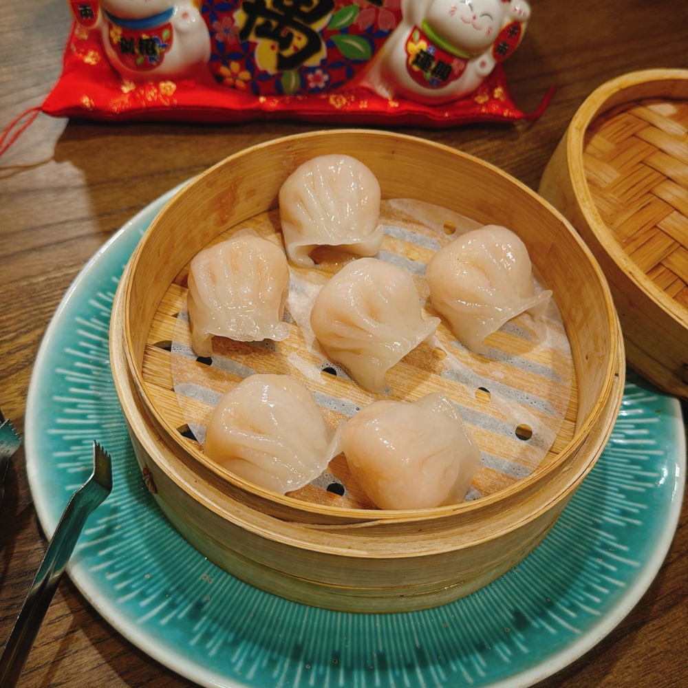 Steamed shrimp dumplings in bamboo steamer at JBC Rice Noodles Ramen & Dumplings, a Asian Restaurant in Astoria