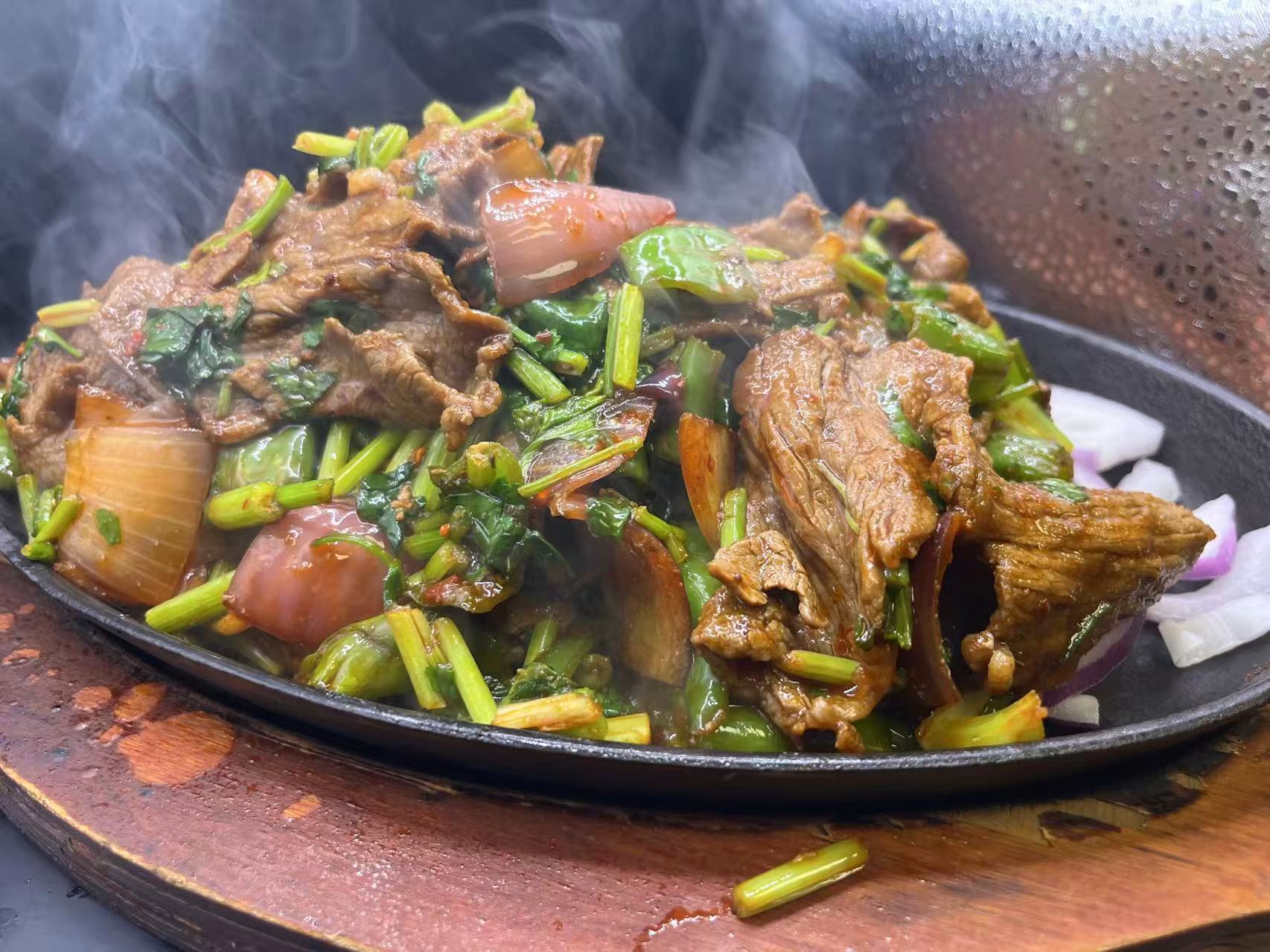 Sizzling iron-plate beef with celery and mixed onion veggies at JiangNan Philadelphia, a Chinese Restaurant in Philadelphi