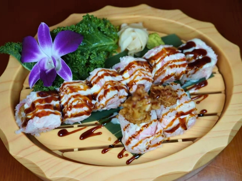 Creamy sushi roll with sauce & toppings at Koi Ramen & Sushi, a Japanese Restaurant in Johnstown