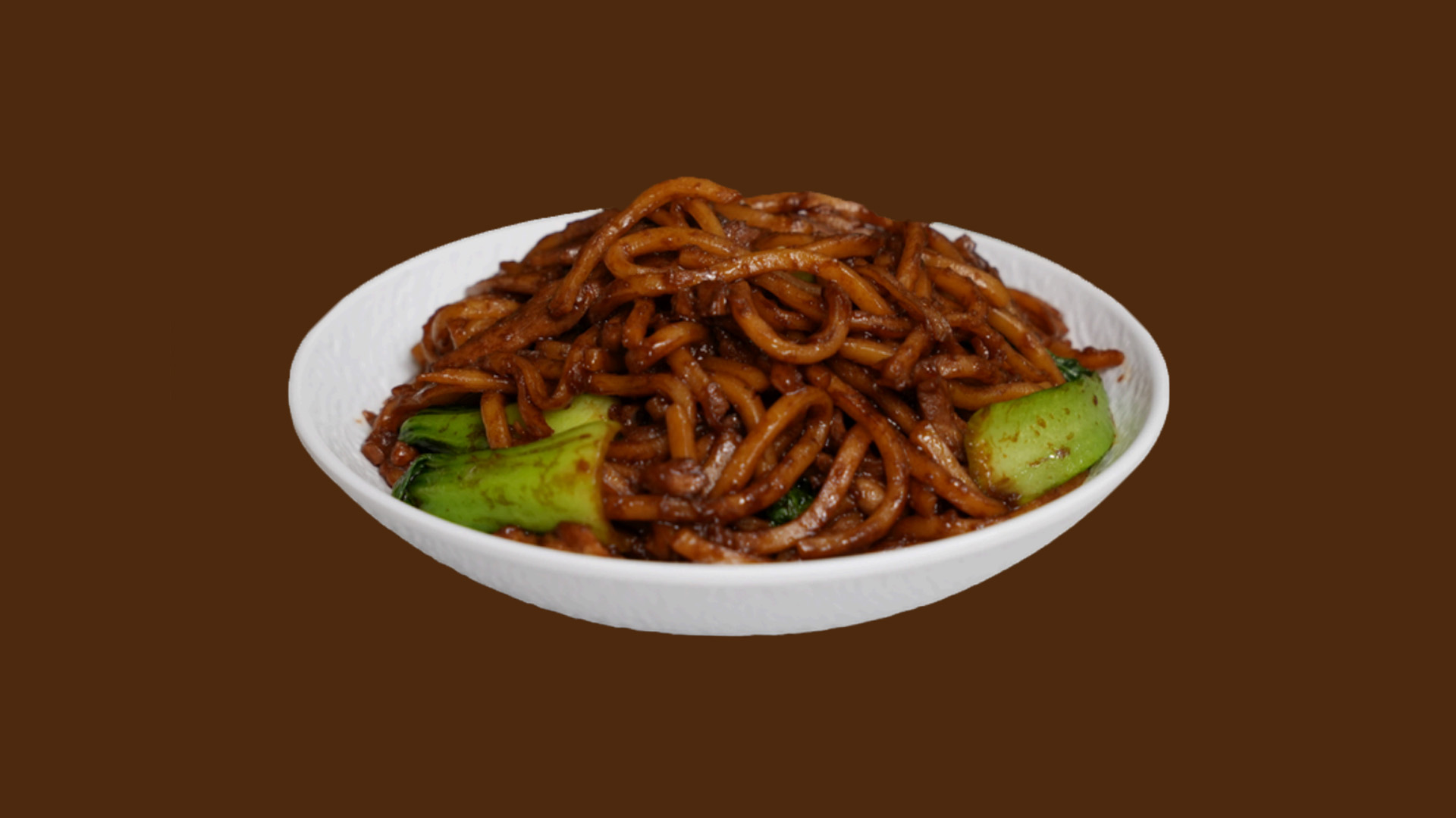 Braised thick noodles with bok choy on white plate at JoyFu Dim Sum, a Dim Sum Restaurant in New York