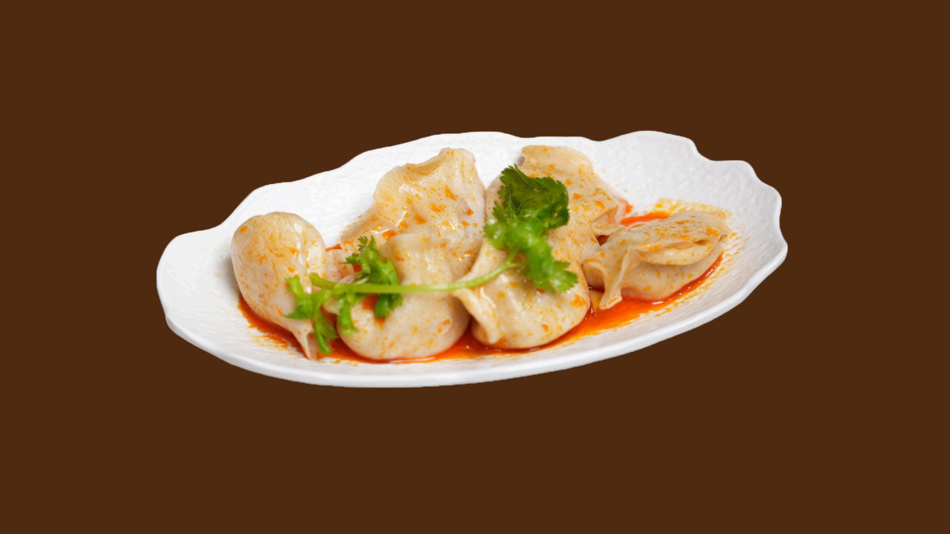 Cold boiled dumplings with spicy red oil and cilantro at JoyFu Dim Sum, a Dim Sum Restaurant in New York