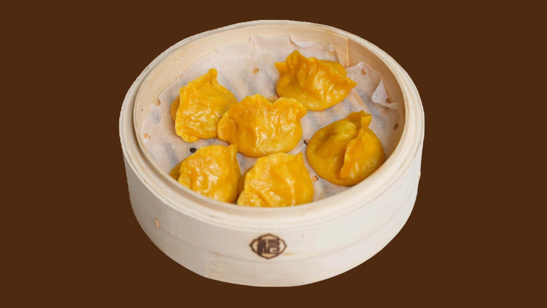 Golden yellow crystal shrimp dumplings in bamboo steamer at JoyFu Dim Sum, a Dim Sum Restaurant in New York