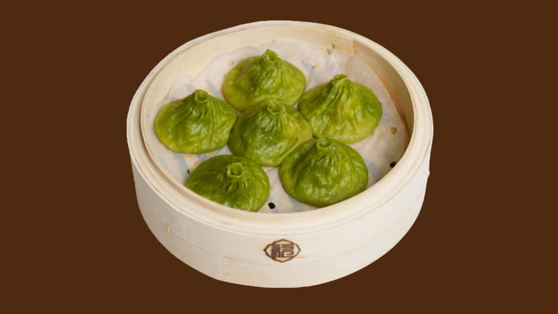 Green vegetable soup dumplings in bamboo steamer at JoyFu Dim Sum, a Dim Sum Restaurant in New York
