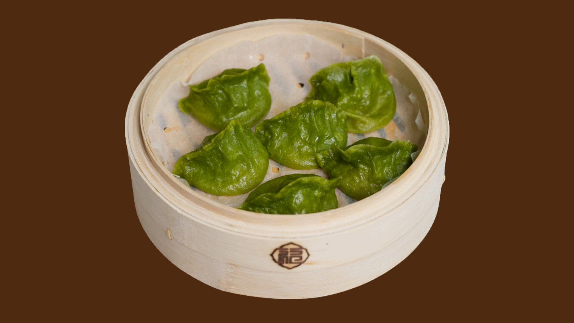 Jade green crystal vegetable dumplings in bamboo steamer at JoyFu Dim Sum, a Dim Sum Restaurant in New York