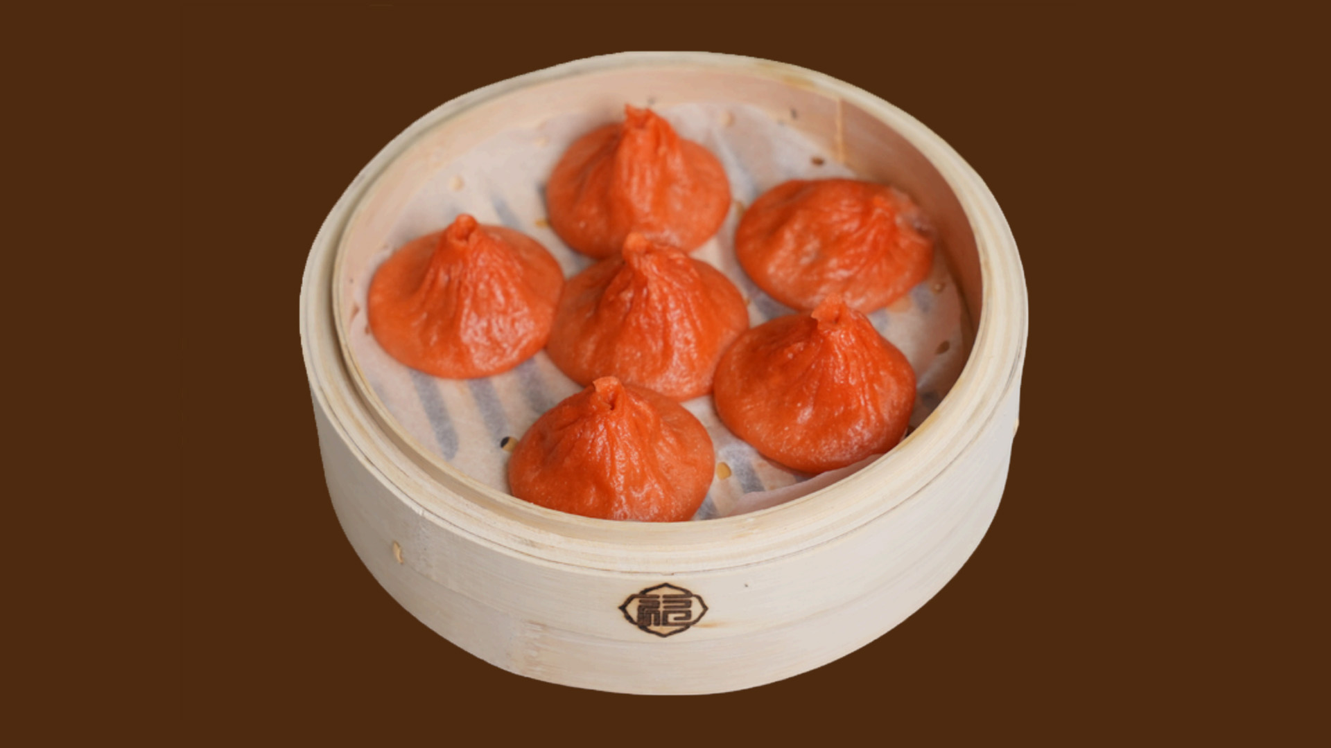 Red wrapper pork soup dumplings in bamboo steamer at JoyFu Dim Sum, a Dim Sum Restaurant in New York