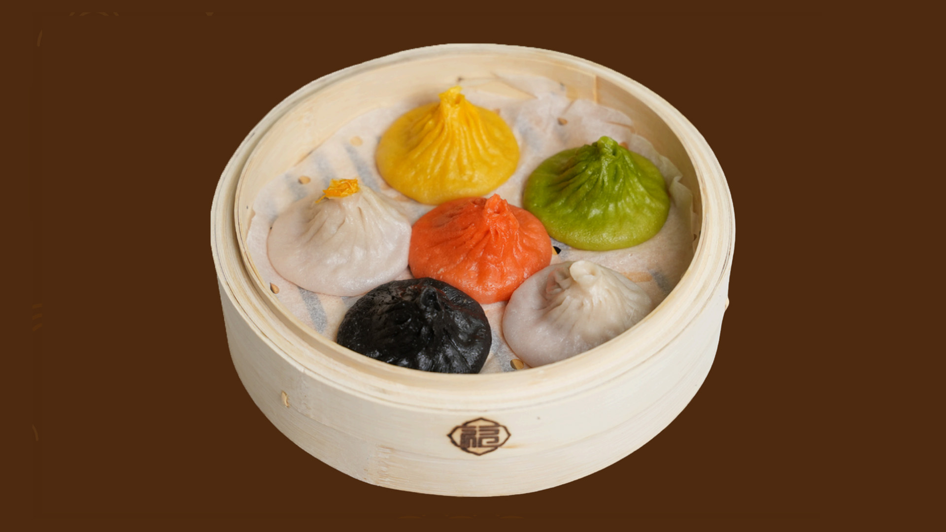 Six-color assorted soup dumplings in bamboo steamer at JoyFu Dim Sum, a Dim Sum Restaurant in New York