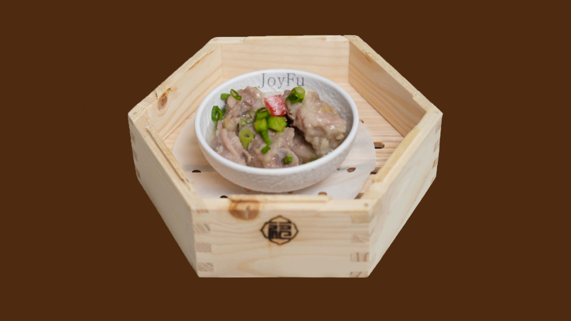 Steamed spare ribs with green onion in hexagonal wooden tray at JoyFu Dim Sum, a Dim Sum Restaurant in New York