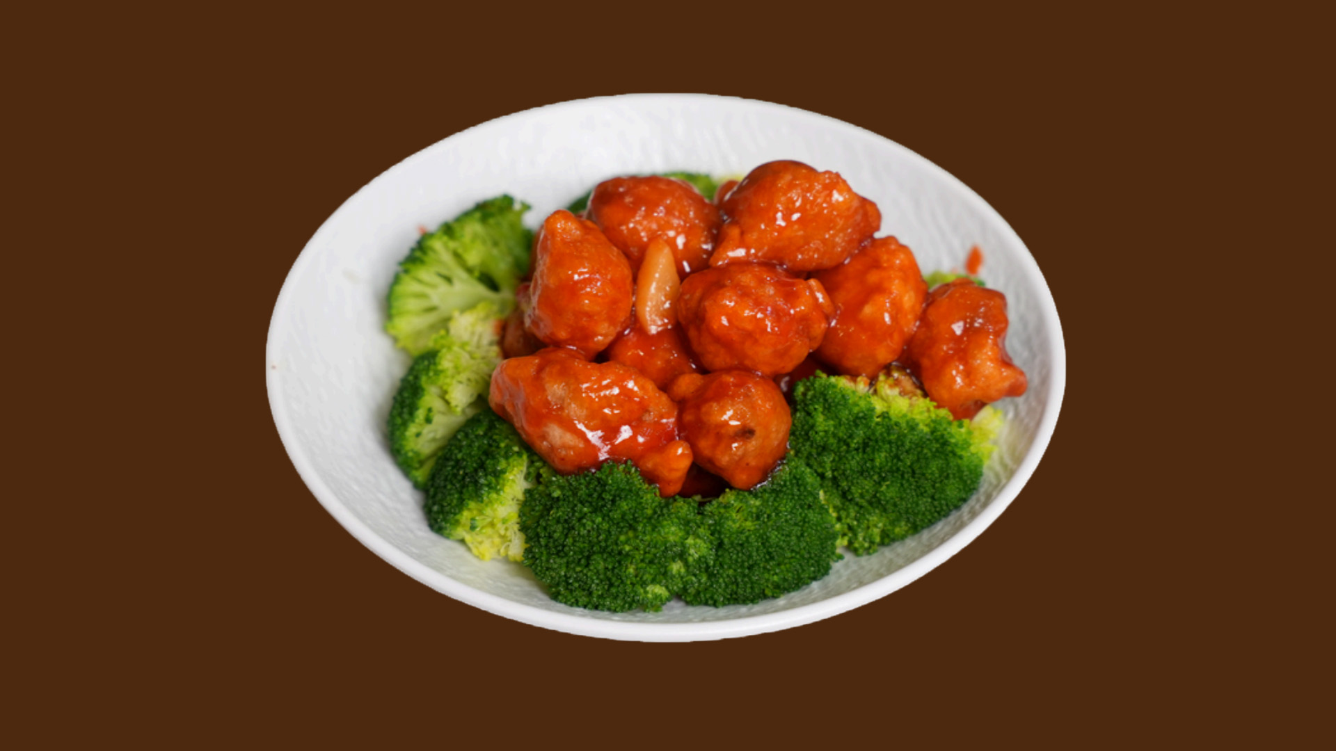 Sweet sour pork bites served with broccoli on white plate at JoyFu Dim Sum, a Dim Sum Restaurant in New York