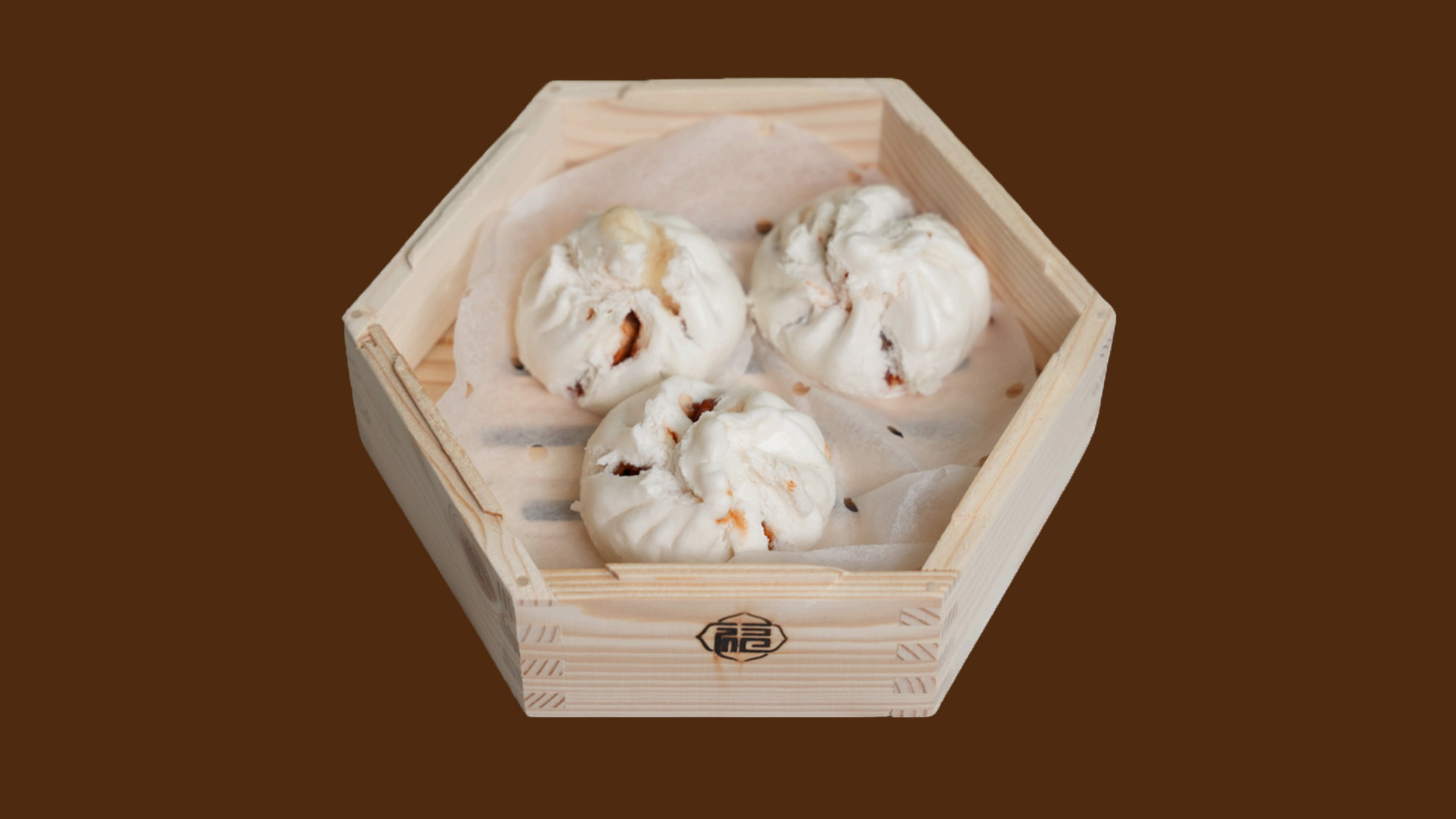 Three soft baked char siu buns in hexagonal wooden tray at JoyFu Dim Sum, a Dim Sum Restaurant in New York
