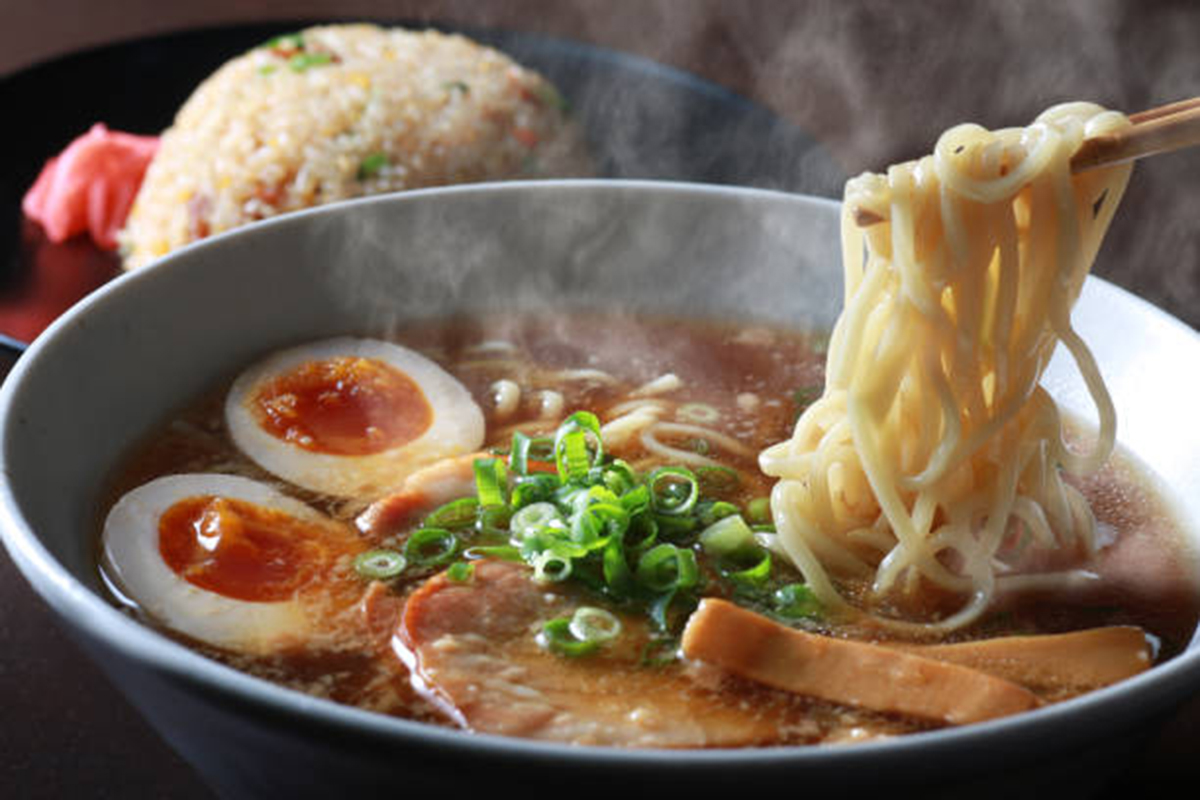 Japanese ramen bowl with noodles, egg, and savory broth