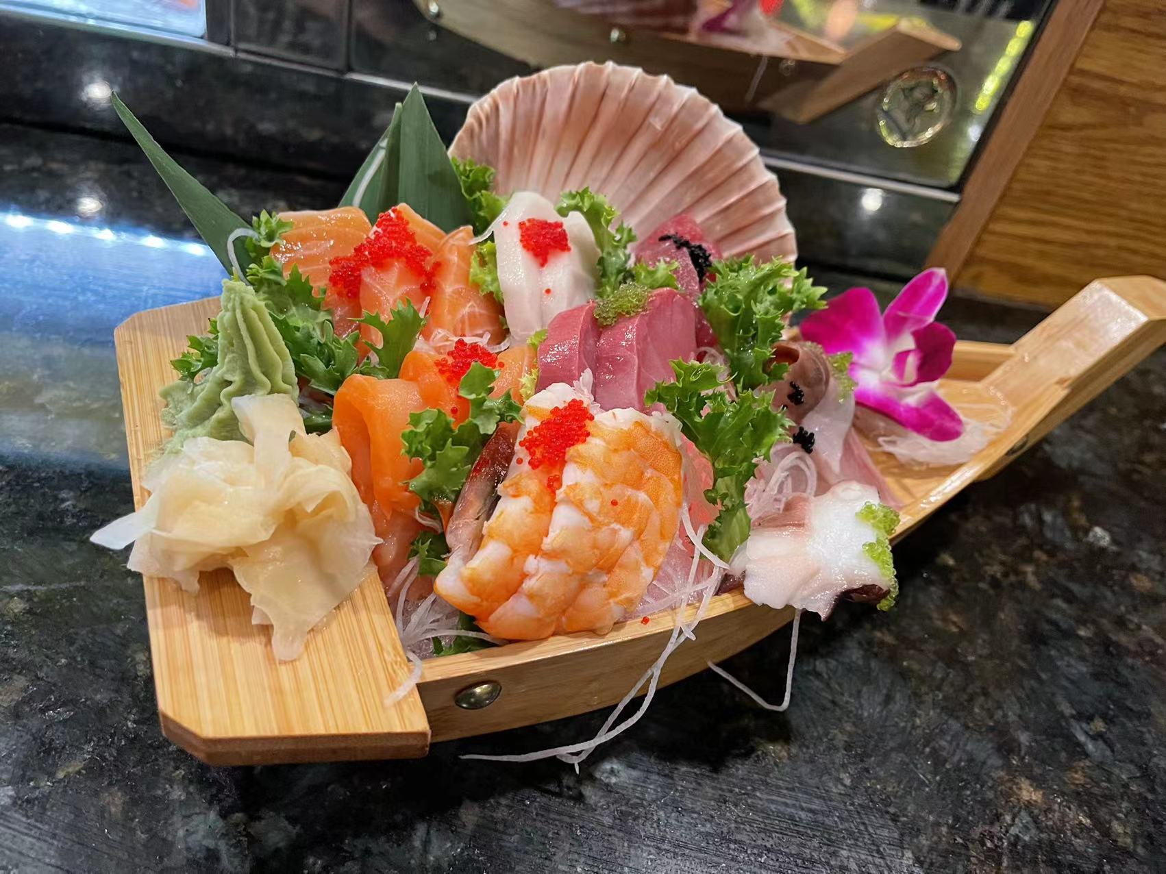 Assorted Sashimi Platter - Fresh slices of various sashimi, beautifully garnished at J&P Asian Fusion, a Asian Fusion Restaurant in Cape Coral