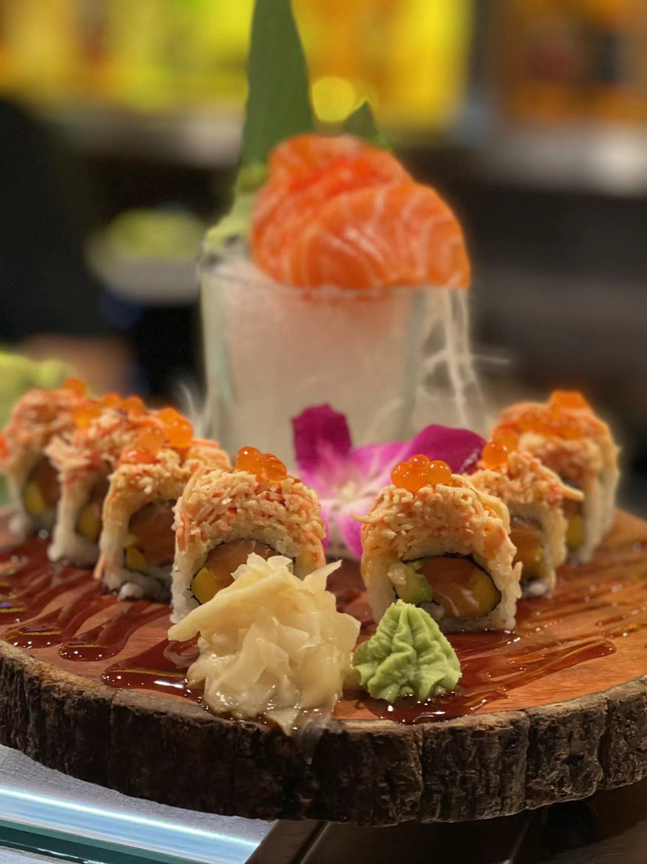 Salmon Roll and Sashimi Dish - Salmon - based sushi rolls and sashimi, beautifully arranged at J&P Asian Fusion, a Asian Fusion Restaurant in Cape Coral