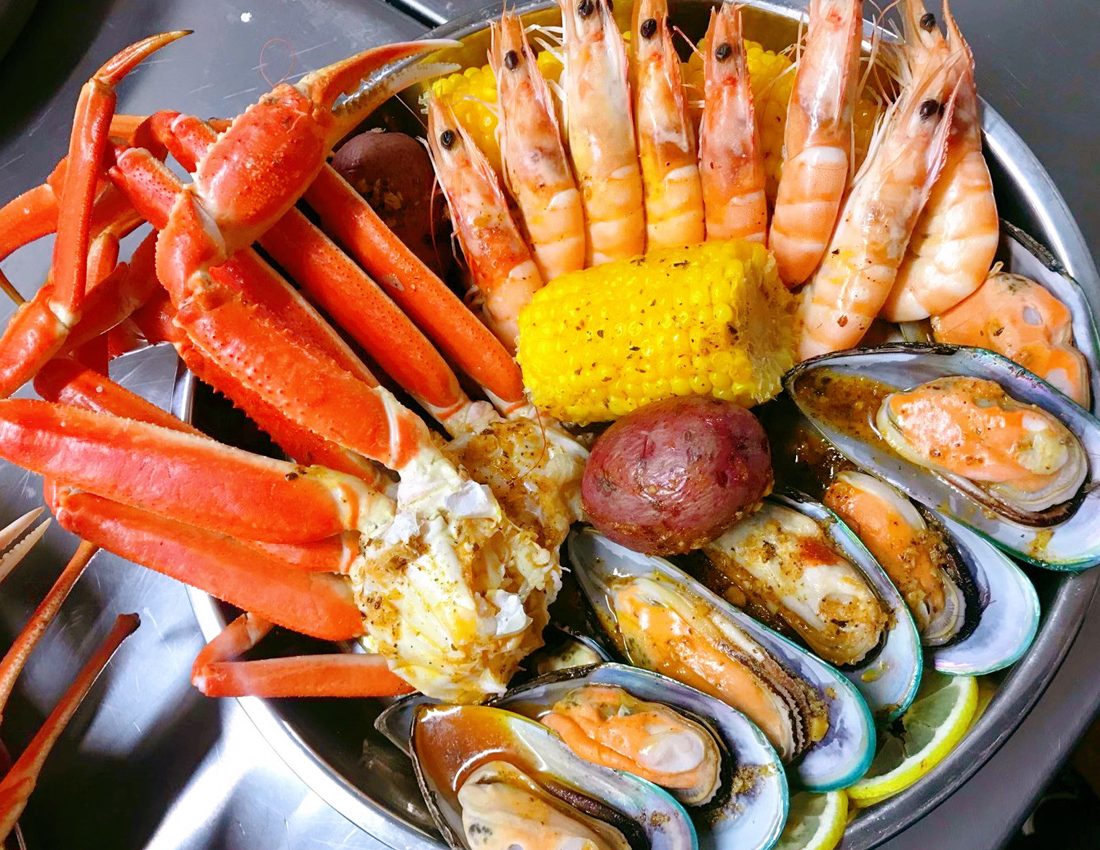 Snow crab and mussels platter at Juicy King Crab Express, a Seafood Restaurant in Brooklyn