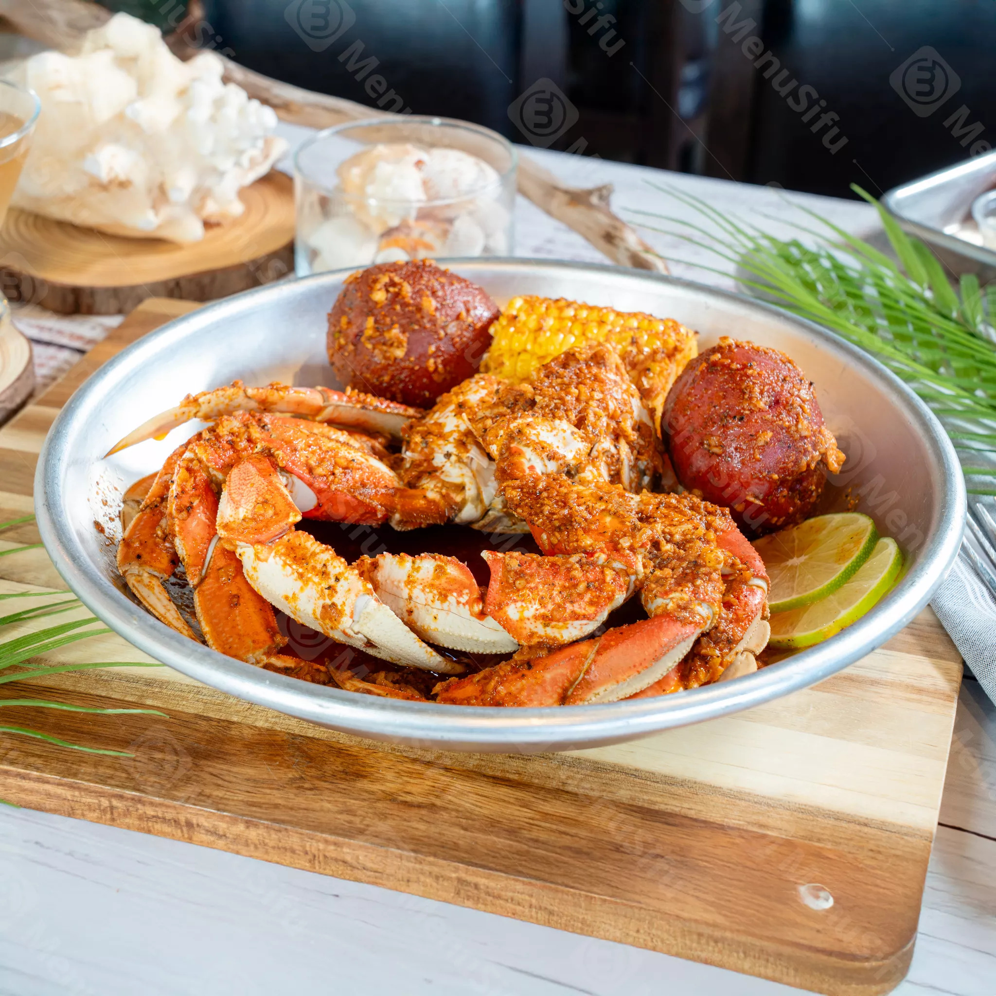 Spicy crab platter with corn and potatoes at Juicy Seafood And Bar, a Seafood Restaurant in TX