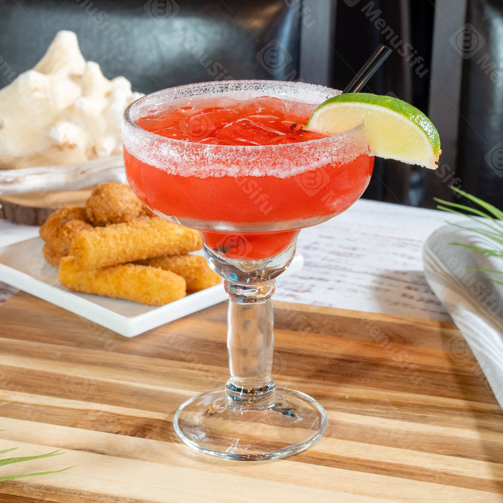 Red margarita with lime and salt rim at Juicy Seafood And Bar, a Seafood Restaurant in TX