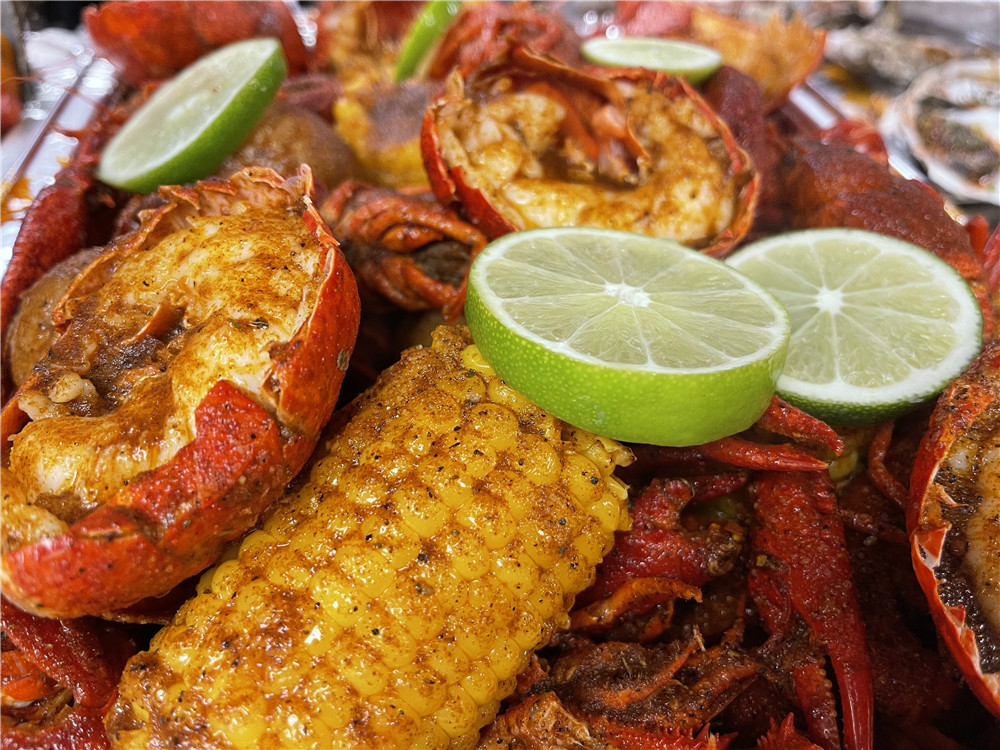 Hearty seafood boil with crawfish, shrimp, and lime at The Juicy Seafood-Pearl, a Seafood in Pearl