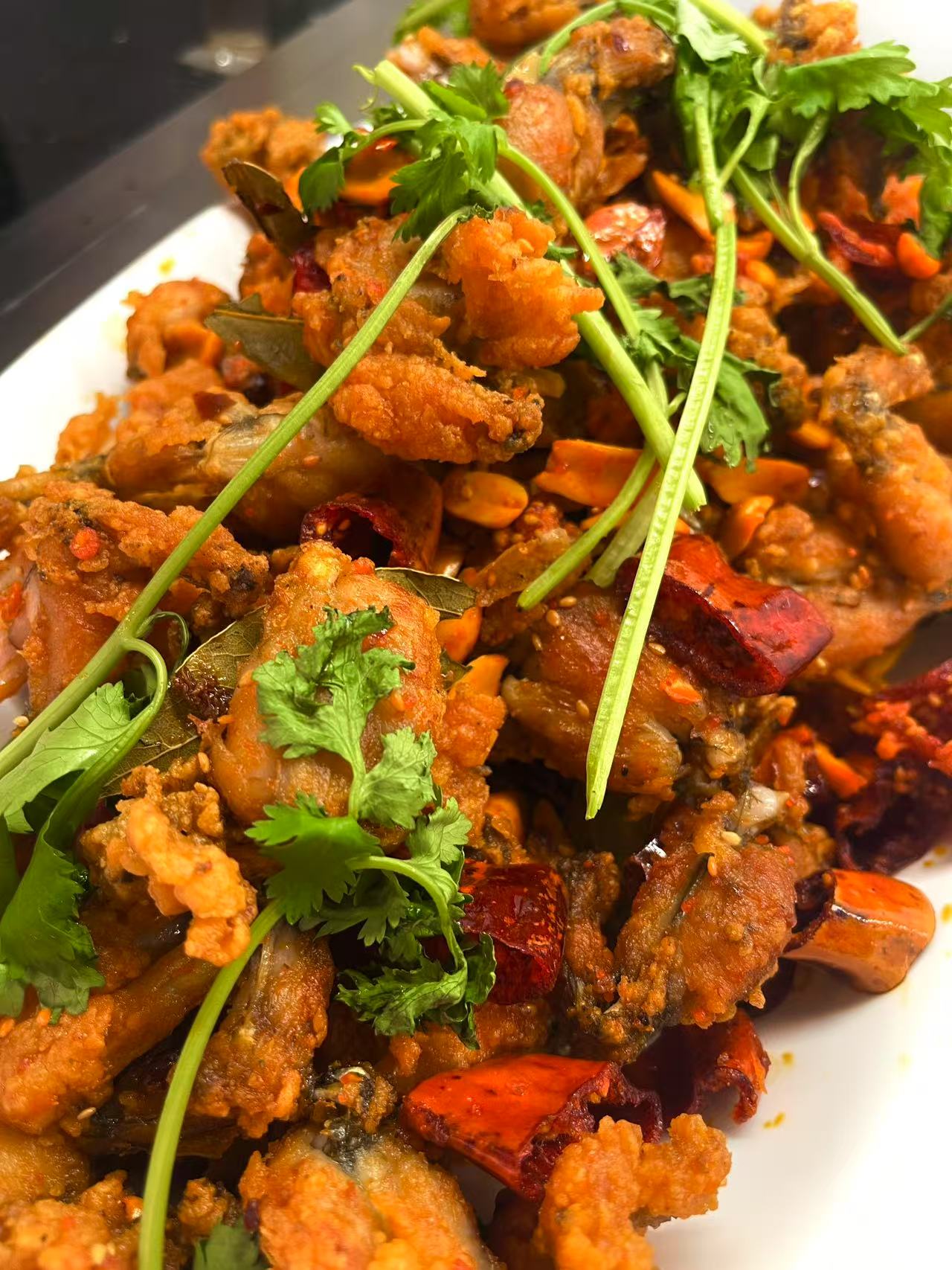 picy Fried Frog - Deep - fried frog pieces with chili peppers and cilantro for a spicy kick at JW Asian Seafood Buffet, a Buffet restaurant in Long Island City