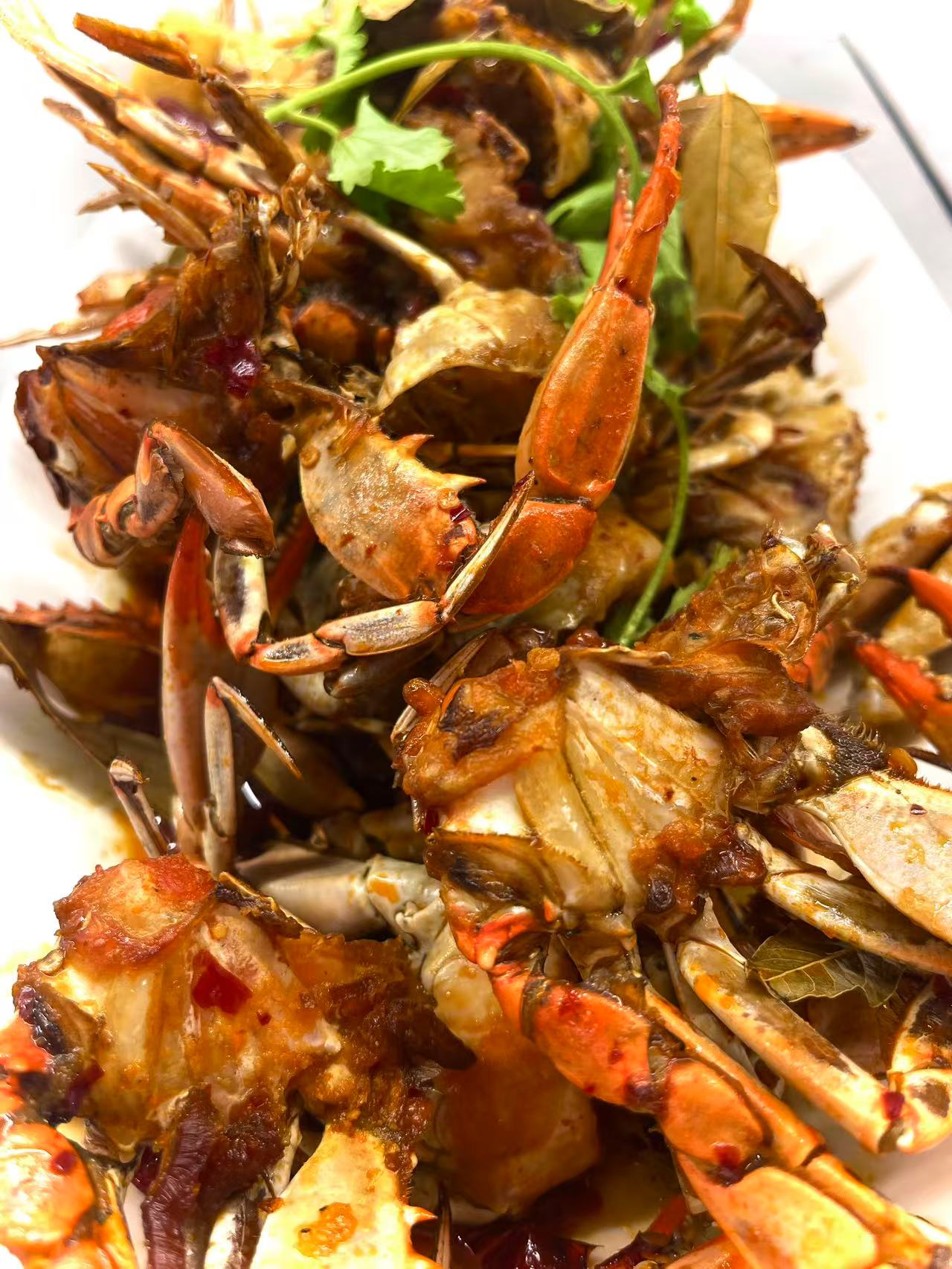 Spicy Fried Crab - Crabs stir-fried with spices and garnished with cilantro at JW Asian Seafood Buffet, a Buffet restaurant in Long Island City