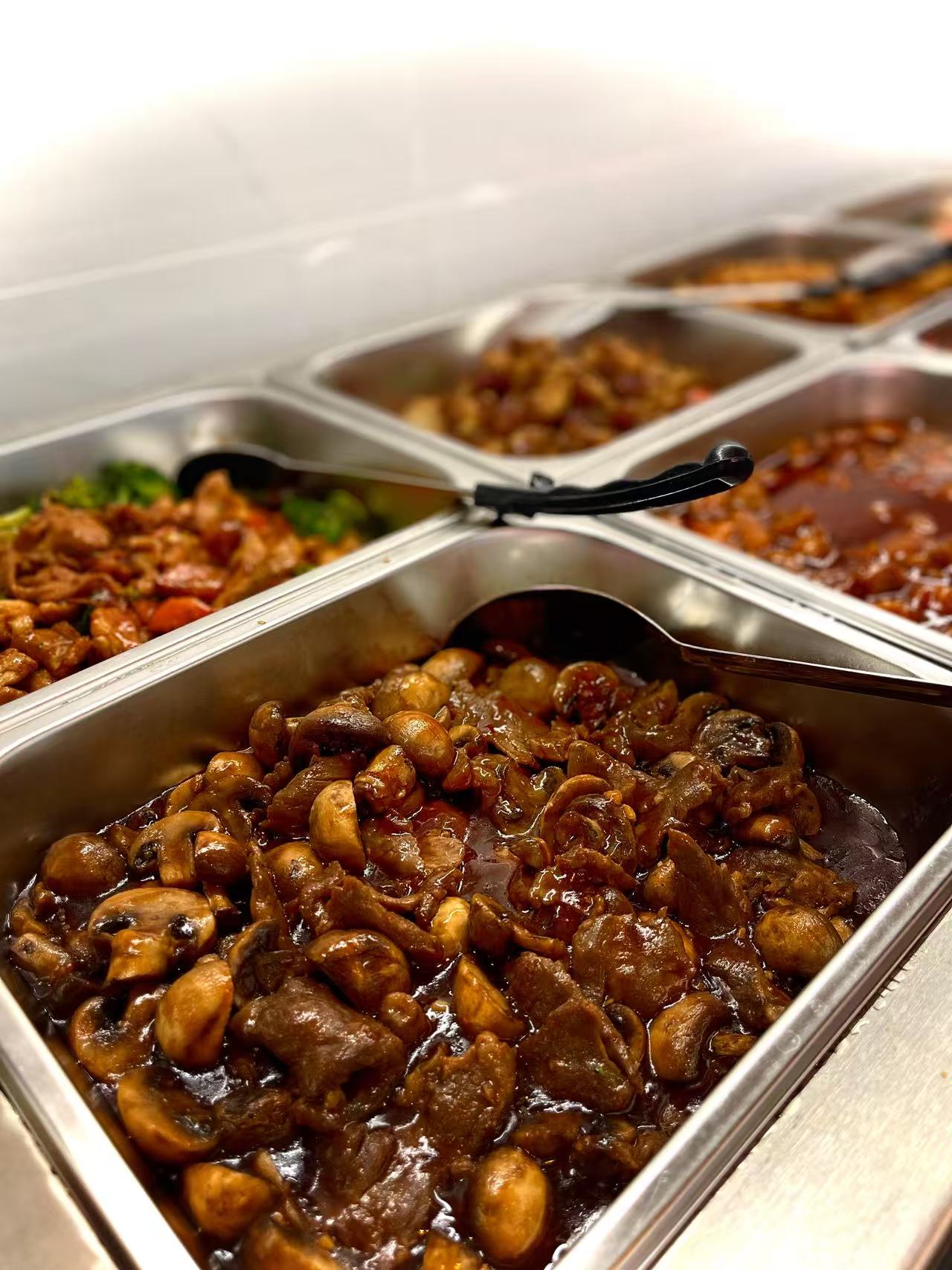 Mushroom Stew - Tender mushrooms in a rich sauce, perfect for pairing with rice at JW Asian Seafood Buffet, a Buffet restaurant in Long Island City