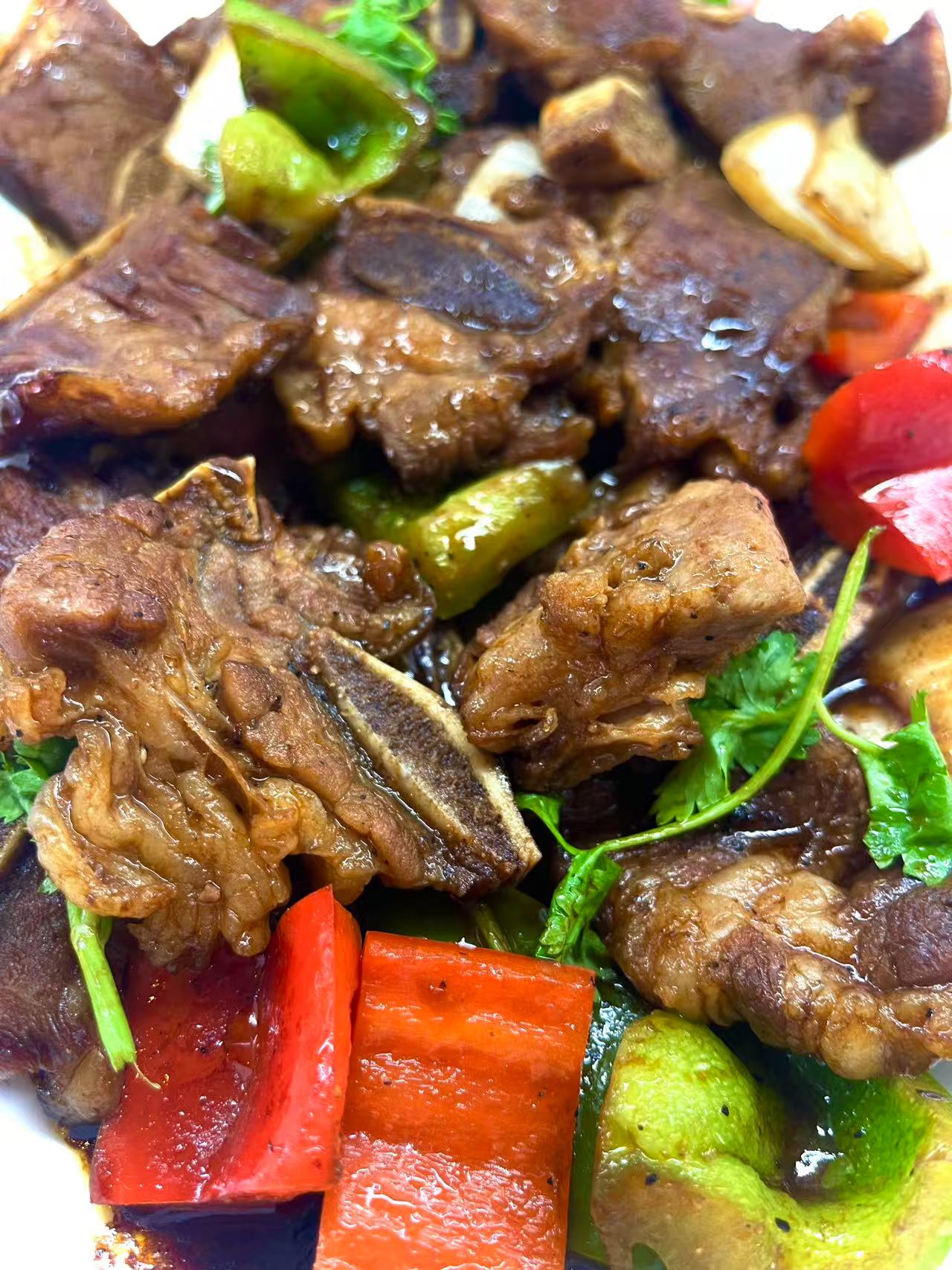 Pepper Steak Stir-Fry - Tender steak stir-fried with green chilies and red peppers at JW Asian Seafood Buffet, a Buffet restaurant in Long Island City