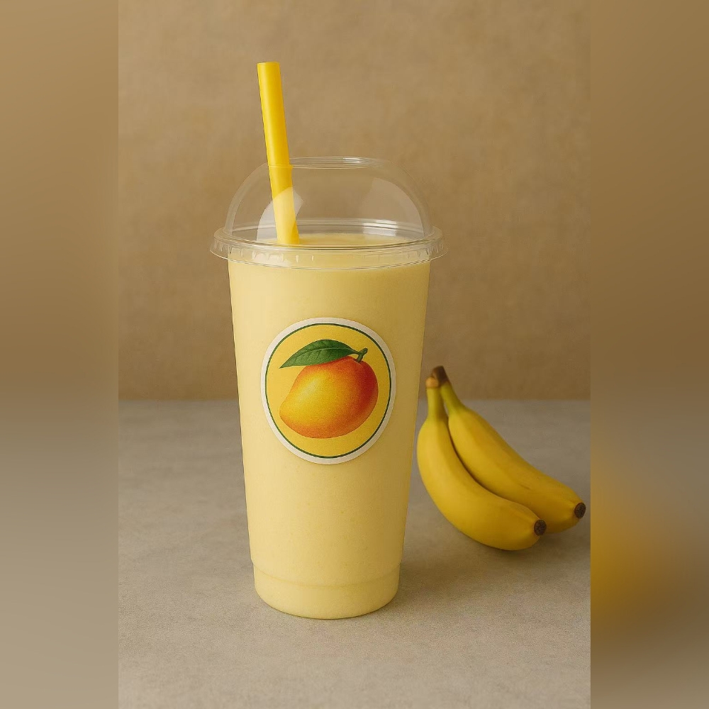 Mango banana smoothie in a cup at Kabul Icy Treats Cafe شیریخ و ژاله, a Ice Cream Shop in Concord