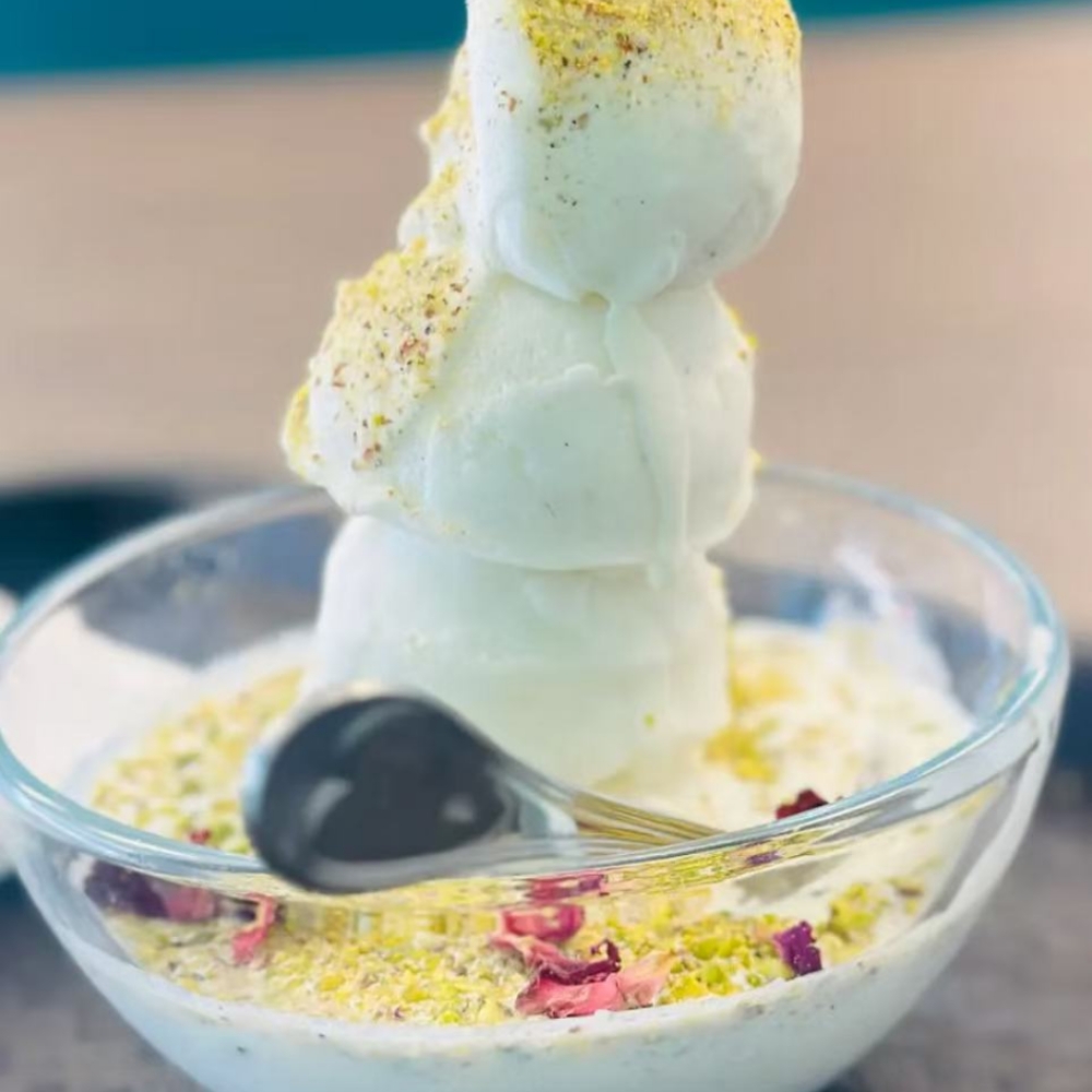 Pistachio ice cream sundae with toppings at Kabul Icy Treats Cafe شیریخ و ژاله, a Ice Cream Shop in Concord
