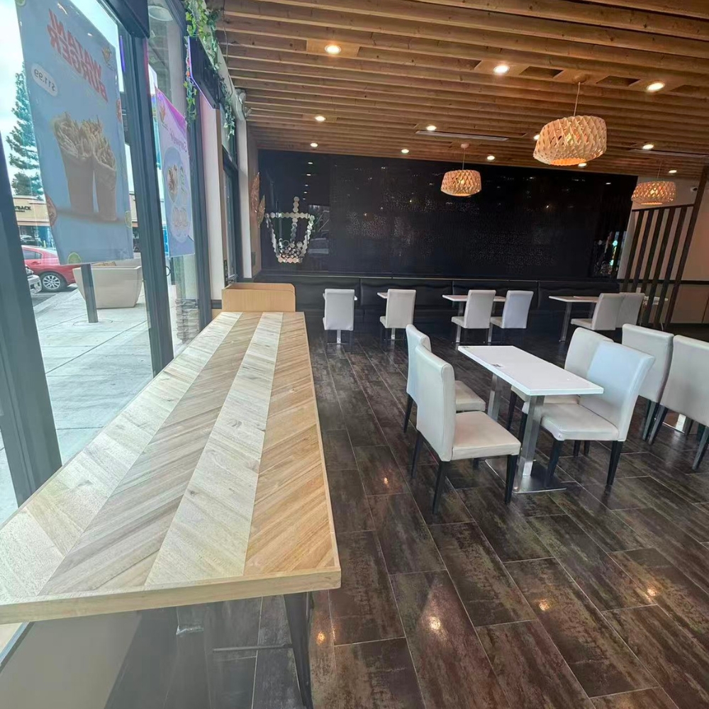 Neat dining area with tables and chairs at Kabul Icy Treats Cafe شیریخ و ژاله, a Ice Cream Shop in Concord