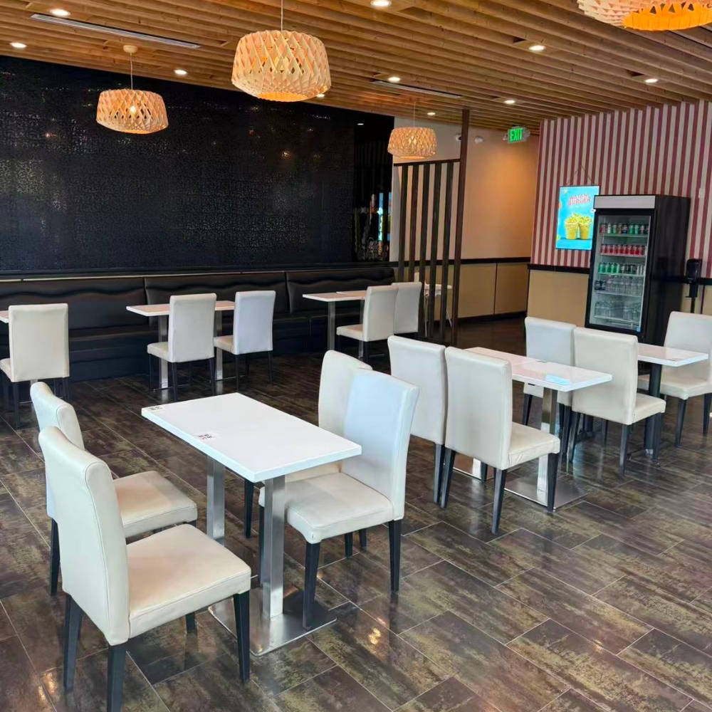 Spacious dining space with white tables and chairs at Kabul Icy Treats Cafe شیریخ و ژاله, a Ice Cream Shop in Concord