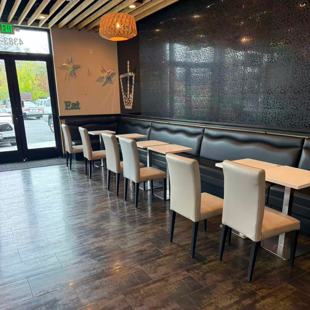 Restaurant interior with booths and tables at Kabul Icy Treats Cafe شیریخ و ژاله, a Ice Cream Shop in Concord