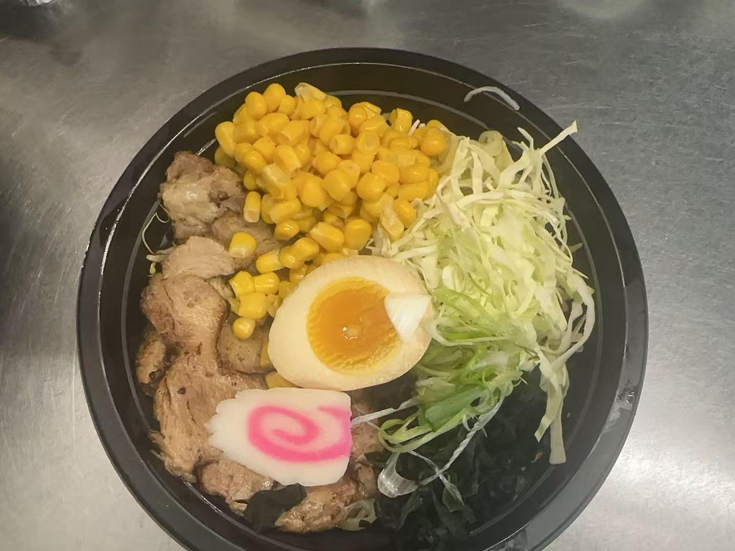 Tonkotsu Ramen Bowl Ramen with pork, egg, veggies, and corn at Kakkoii Sushi and Ramen, a Japanese restaurant in Malden