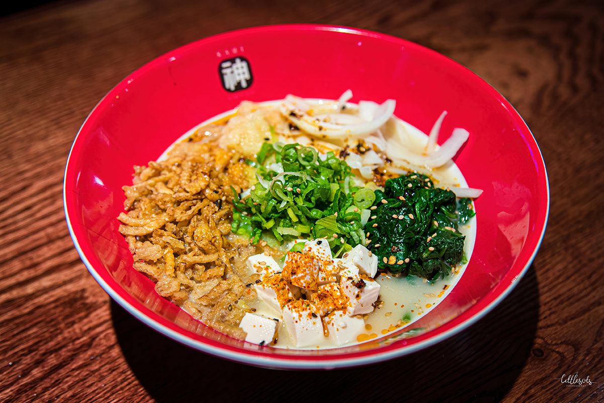 Creamy tonkotsu ramen loaded with tofu, crispy fried bits and greens at Kami Ramen & Sushi, a Japanese Restaurant in Humble。