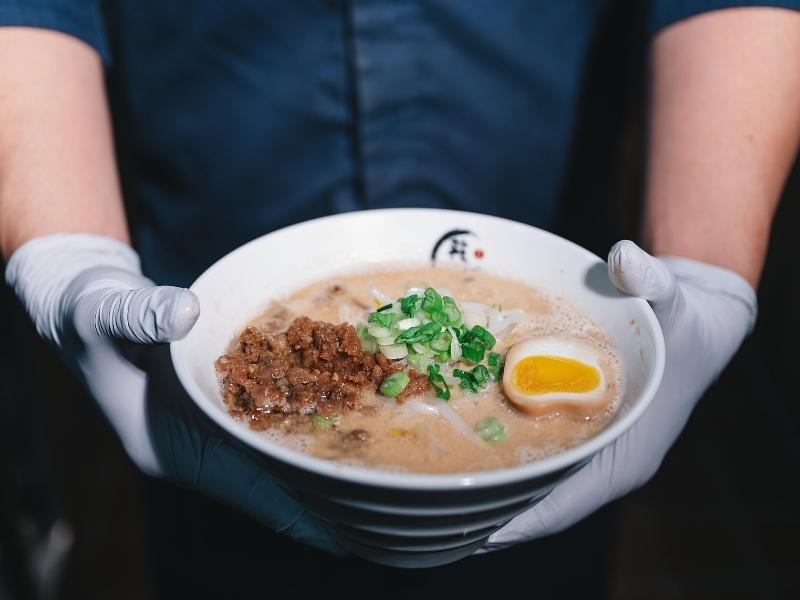 Creamy tantanmen ramen with minced pork, egg, and green onions at Kanpai Ramen, a Ramen Restaurant in New Port Richey