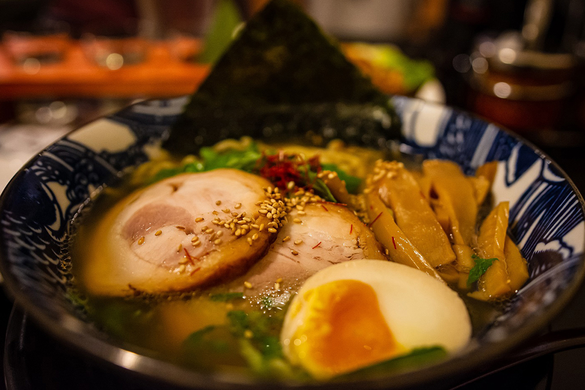 Japanese ramen with chashu pork, soft-boiled egg, bamboo shoots, and seaweed