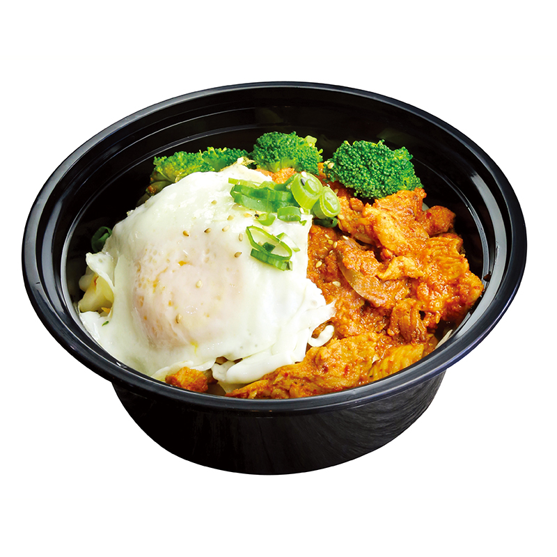 Spicy marinated chicken rice bowl with soft fried egg and broccoli florets at K-Bop, a Korean Restaurant in Austin