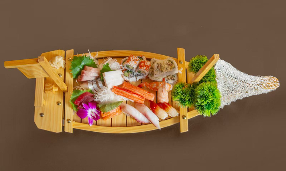 Sushi boat with assorted sashimi and rolls at Kenichi Asian Bistro, a Asian Restaurant in Worcester