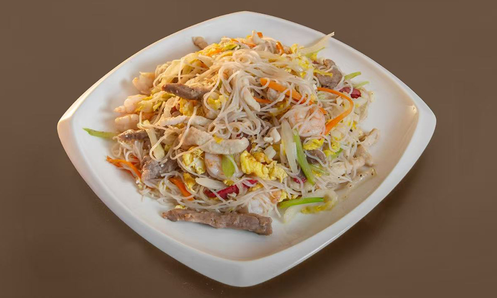 Stir-fried rice noodles with shrimp, meat, eggs, and vegetables at Kenichi Asian Bistro, a Asian Restaurant in Worcester