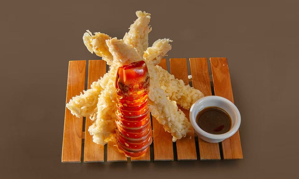 Lobster tail fried in tempura batter served with dipping sauce at Kenichi Asian Bistro, a Asian Restaurant in Worcester