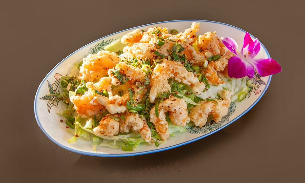 Assorted BBQ meats and sushi in a wooden box with shrimp, oysters, salmon, and marinated beef at Daruma BBQ & Sushi AYCE, a Asian Restaurant in Holyoke