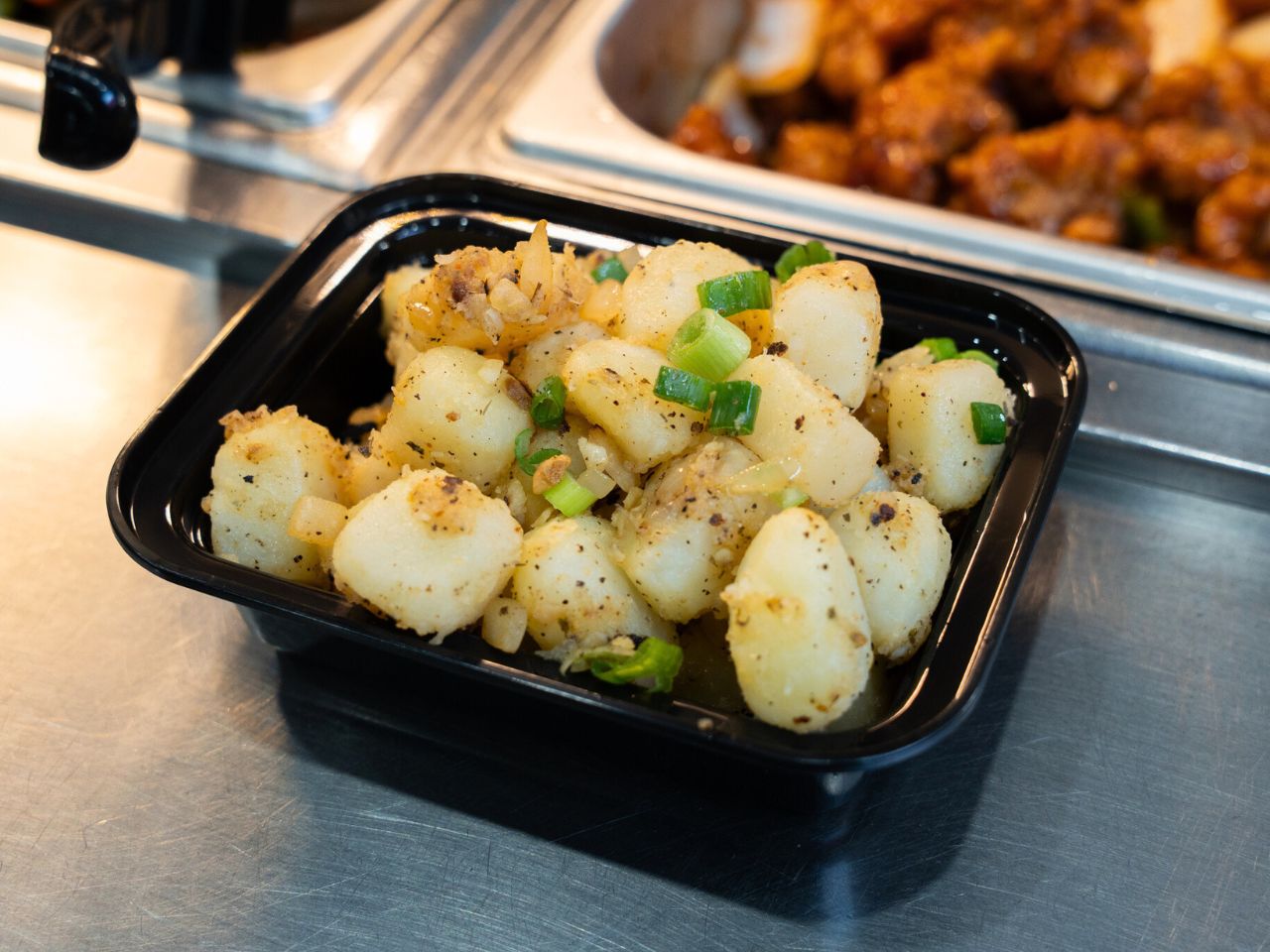 Pan-seared scallops with salt, pepper and scallions at Kennys Wok, a Chinese Restaurant in Philadelphia