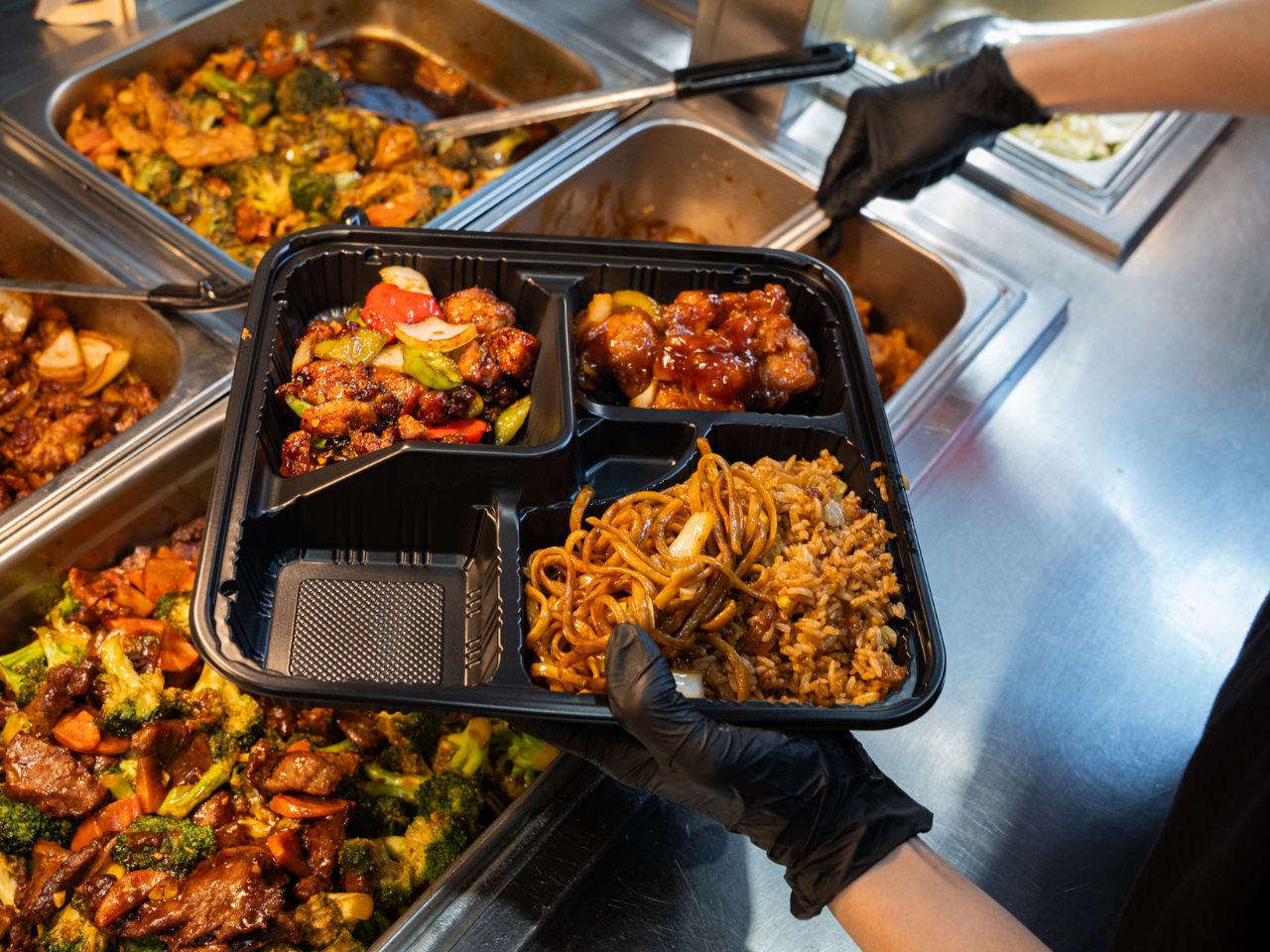Takeout combo with General Tso chicken, chow mein and fried rice at Kennys Wok, a Chinese Restaurant in Philadelphia