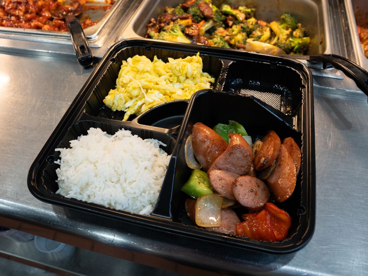 Breakfast plate with sausage, scrambled eggs and rice at Kennys Wok, a Chinese Restaurant in Philadelphia