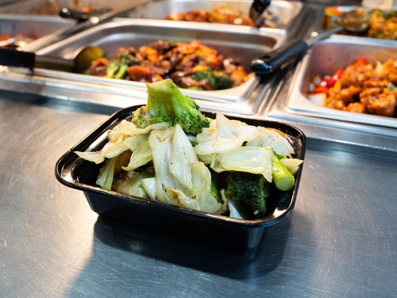 Sautéed cabbage and broccoli in light sauce at Kennys Wok, a Chinese Restaurant in Philadelphia