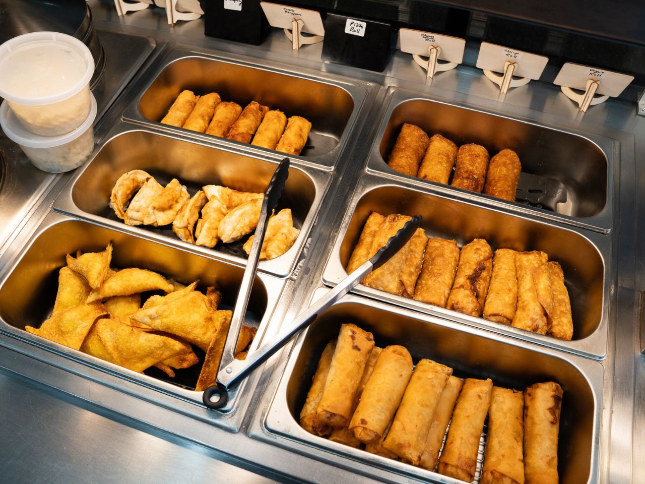 Assorted fried appetizers including egg rolls and wontons at Kennys Wok, a Chinese Restaurant in Philadelphia