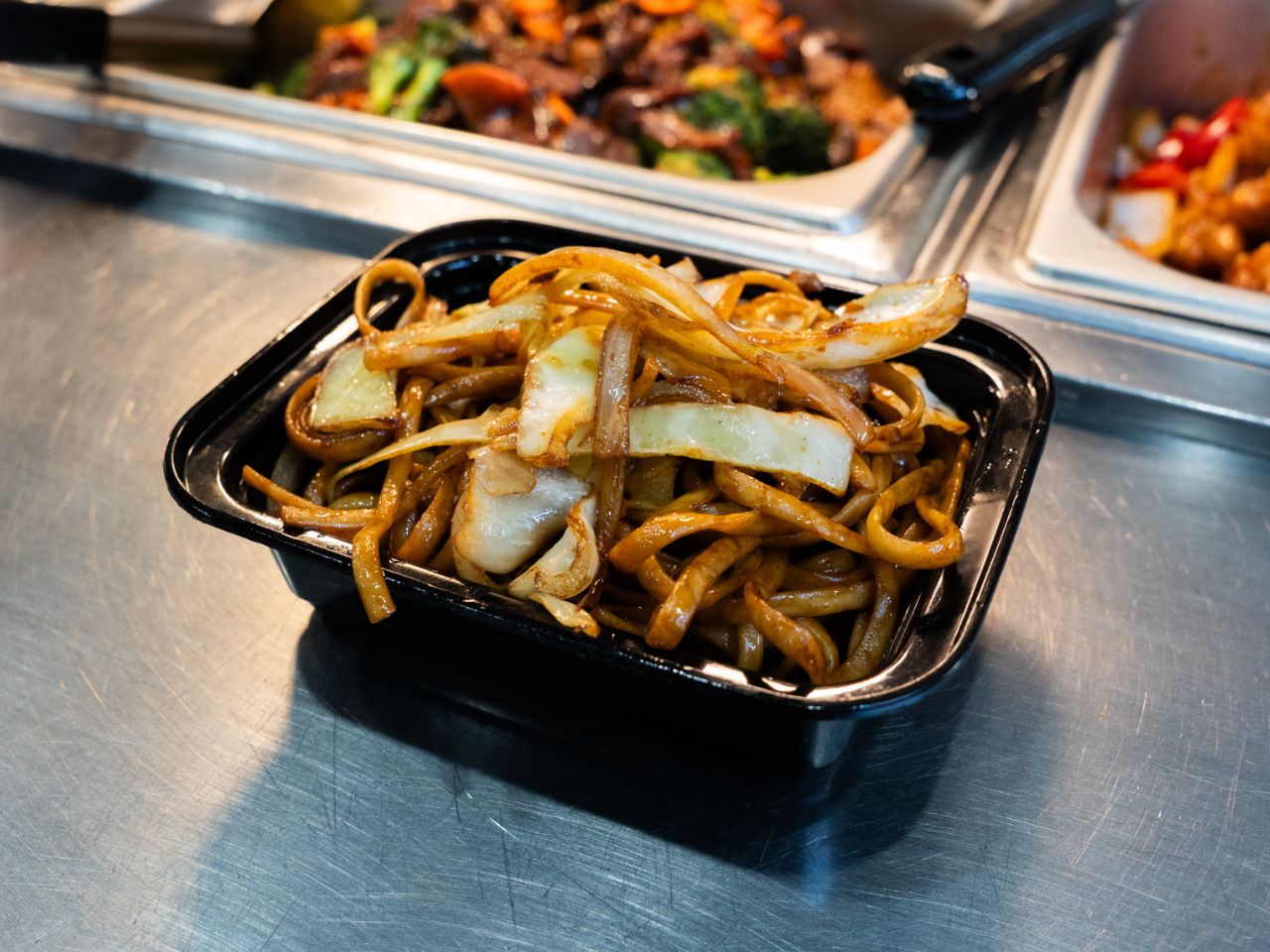 Stir-fried egg noodles with beef and onions at Kennys Wok, a Chinese Restaurant in Philadelphia