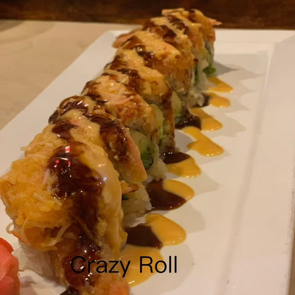 Crazy Roll sushi drizzled with two kinds of savory sauces