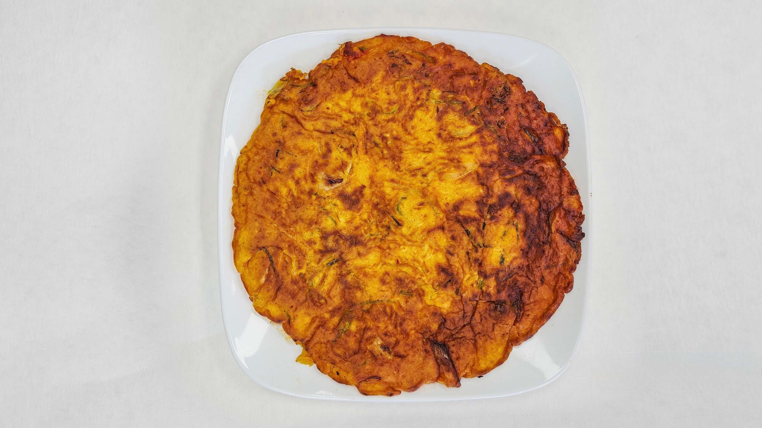 Savory kimchi pancake, crispy & flavorful at Kimchi & Ramen Express Train,a Korean Restaurant in Cape Elizabeth